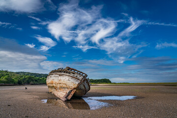 Wall Mural - walking around an old ship wreck of City Dulas Anglesey