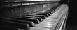 © aicandy - A close-up, monochromatic image of a classic piano keyboard with visible texture and contrast, highlighting the intricate details of the keys and woodwork, captured in a dramatic and artistic style