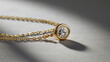 © The Pattern Forest - A gold necklace with a single diamond pendant on a grey background.