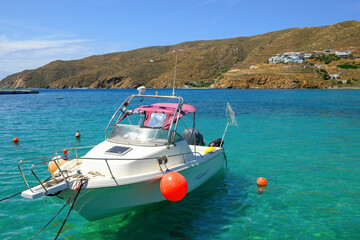 Wall Mural - Boat moored in Aegiali Bay at the northern side of Amorgos island. Greece