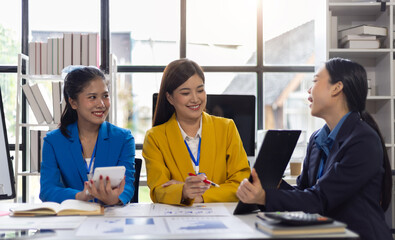 Wall Mural - Business meeting, coworkers are discussing planning a new project in the office. Talking and sharing ideas with colleagues.