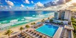 © Sujid - Aerial view of a rooftop pool and hotel in Cancun, Mexico overlooking a beautiful ocean beach, rooftop, pool, hotel, Cancun, Mexico