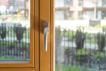 Wall Mural - Metal handle on wooden window frame on balcony door