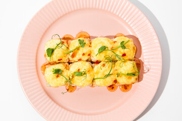 Sticker - Delicious Baked Sushi Roll with Sesame, Cheese Topping, and Sweet Chili Sauce on Pink Plate