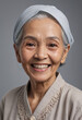 © jarntag - Portrait view of a regular happy smiling Malaysia old woman, ultra realistic, candid, social media, avatar image, plain solid background