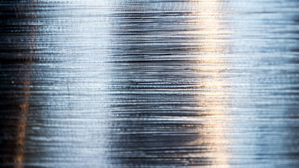 Wall Mural - Close up of a brushed metal background with horizontal grain texture silver and gray tones 