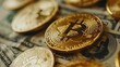 © Resi - Gold bitcoin cryptocurrency coins lying on us dollar banknotes