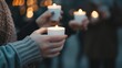 © May Chanikran - People holding lit candles during a peaceful evening vigil, demonstrating unity and remembrance with soft, glowing lights in the background.