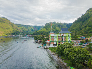 Aerial drone view of small town by  Toba Lake side at Haranggaol in Simalungun, Sumatra Utara, Indonesia