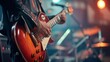 © Stone Story - Close-up of a guitarist playing an electric guitar on stage at a live music concert, with vibrant lighting effects and a dynamic atmosphere.