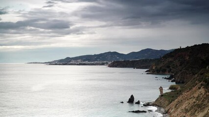 Sticker - Time lapse of dark clouds moving over spanish coast in Andalucia. Cliffs of Maro Cerro Gordo Natural Park, near Maro and Nerja, Malaga province, Costa Del Sol, Spain.
