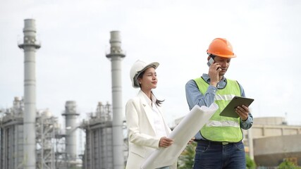 Wall Mural - Planning engineering and project leader working and check Plans at Industrial Site on power plant.