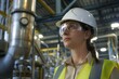 © Pist L. - Proficient Female Engineer in Chemical Plant Wearing Safety Gear in Industrial Setting