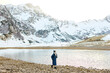 © makedonski2015 - European woman stands by a mountain lake