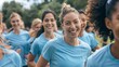 © spyrakot - Friends Enjoying Fun Run for Diabetes Prevention in Matching Blue T-Shirts
