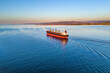 © Leonid - Dry bulk cargo ship underway in sea. Bulk carrier or bulker is a merchant ship to transport unpackaged bulk cargo
