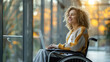 © Sudarshana - wide photo of cute woman in wheelchair using a laptop