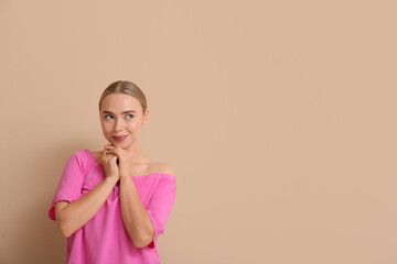 Sticker - Happy young woman on beige background