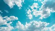 © Dina - A serene blue sky with scattered white clouds, providing a calming background for flight-related content, with ample space for text