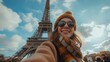 © acnaleksy - Tourist taking a selfie in front of the Eiffel Tower in Paris
