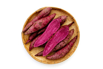 Wall Mural - Purple sweet potato in bamboo weave plate