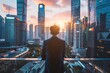 © KanitChurem - Businessman standing on a balcony overlooking a modern city skyline at sunset, reflecting on future opportunities and urban development.