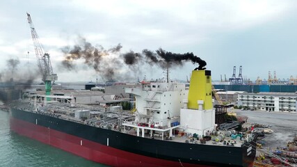 Wall Mural - Smoke exhaust gas emissions carbon dioxide from cargo lagre ship container ship,Marine diesel engine exhaust gas from combustion, Gas Emission Air Pollution from transportation. green house effect 