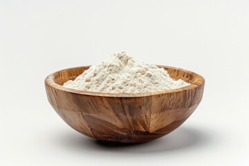 Wall Mural - Heaping wooden bowl is overflowing with white flour and ready for baking