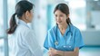 © admin_design - Two Female Healthcare Professionals in Discussion