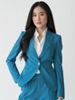 © Surasak-Art - portrait photography of an asian beautiful woman dressed tiffanny blue suit and tidy white formal shirt, black medium long hair, posing for photography, elegantly formal