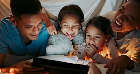 Canvas Print - Laughing, night and tablet with family in bedroom of home together for bonding, love or storytelling. Education, learning or funny with mom, dad and kids on bed in apartment for child development