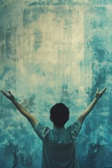 Asian man stands in room with blue wall, arms raised in joy celebration. Wears gray t-shirt, dark hair contrasts with surroundings. Digital art style with grunge old canvas background.