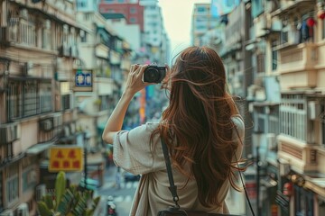 Wall Mural - a woman taking a picture of a city street