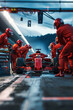 © Emanuel - One race car pit stop with crew in red jumpsuits, competition and teamwork concept
