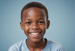 © jarntag - Portrait view of a regular happy smiling Botswana boy, ultra realistic, candid, social media, avatar image, plain solid background