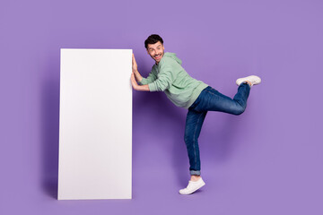 Canvas Print - Full body photo of attractive young man playful lean vertical menu poster wear trendy gray clothes isolated on violet color background