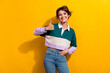 © deagreez - Portrait of pretty nice young girl show thumb up empty space wear shirt isolated on yellow color background