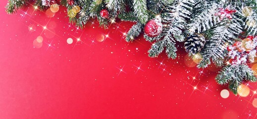 Wall Mural - christmas decorations concept. border of snow-covered fir branches with pine cones and baubles on a 