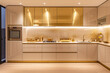 © 18042011 - A sleek and modern kitchen featuring reflective gold cabinets and ambient lighting, offering a chic and sophisticated space for culinary activities and entertaining.