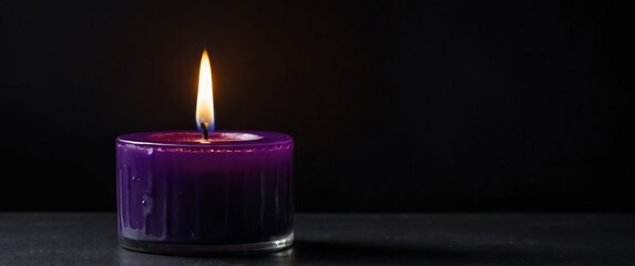 Canvas Print - a purple candle on plain black background for banner with copy space