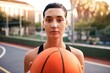 © Chanelle M/peopleimages.com - Ive got my game face on. Cropped shot of an attractive young sportswoman standing on the court alone and holding a basketball during the day.