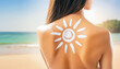 © Thuntaree - A woman with long hair stands with her back turned. Use sunscreen and watch the sun shine on your back. By the beach. Enjoying a sunny day by the sea in a swimsuit. Surrounded by the beauty of nature