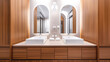 © OMD - Modern bathroom with double sinks, wooden cabinetry, arched mirrors, and wall-mounted light fixture.