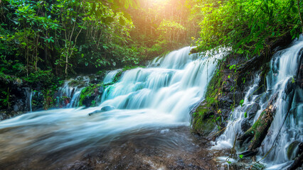 Wall Mural - Beauty in nature, amazing waterfall in tropical forest of national park, Thailand	