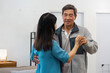 © itchaznong - Elderly Couple Dancing Together in Living Room, Enjoying Quality Time and Bonding