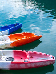 Wall Mural - Kayaks moored for rent on Lake Cheo Lan in Thailand. Kayaking on the lake. Tourist entertainment.