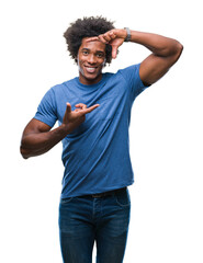 Sticker - Afro american man over isolated background smiling making frame with hands and fingers with happy face. Creativity and photography concept.