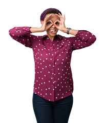 Sticker - Beautiful young african american woman wearing head scarf over isolated background doing ok gesture like binoculars sticking tongue out, eyes looking through fingers. Crazy expression.