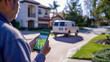 © Anna - Delivery driver using smartphone to track vehicle location on suburban residential street. Logistics, tracking technology, navigation, delivery services, real-time tracking concept.