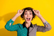 © deagreez - Photo of excited lovely woman wear stylish clothes hands hold glasses isolated on yellow color background